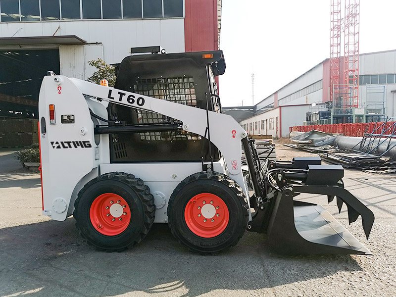 wheeled skid steer loader with grapple